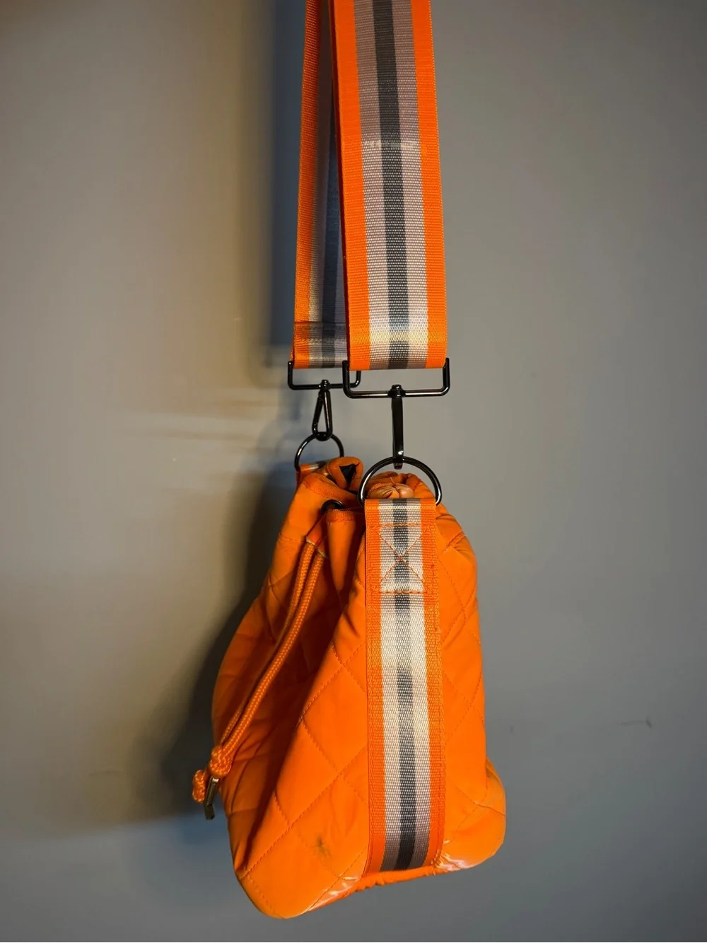 HAUTE SHORE Orange Quilted Crossbody with Striped Strap